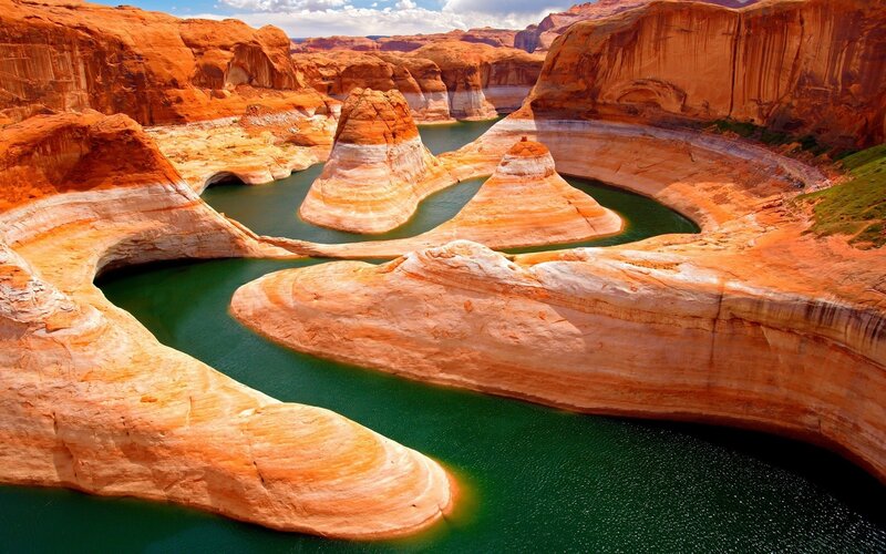 Red rock canyon with green water