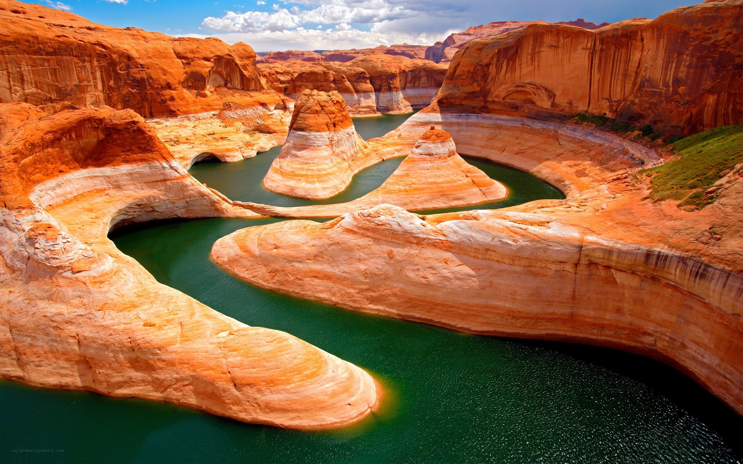 Red rock canyon with green water