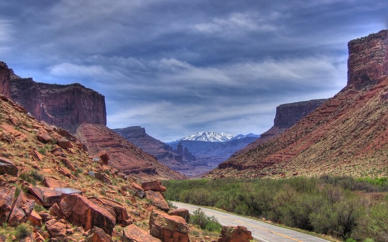 Red rock canyon with snow-capped mountains