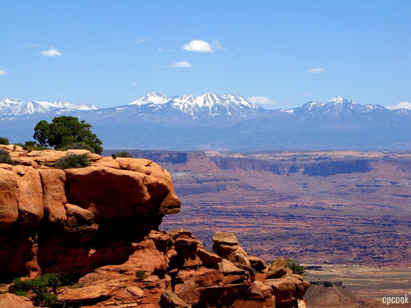 Red rock canyon with snow-capped mountains