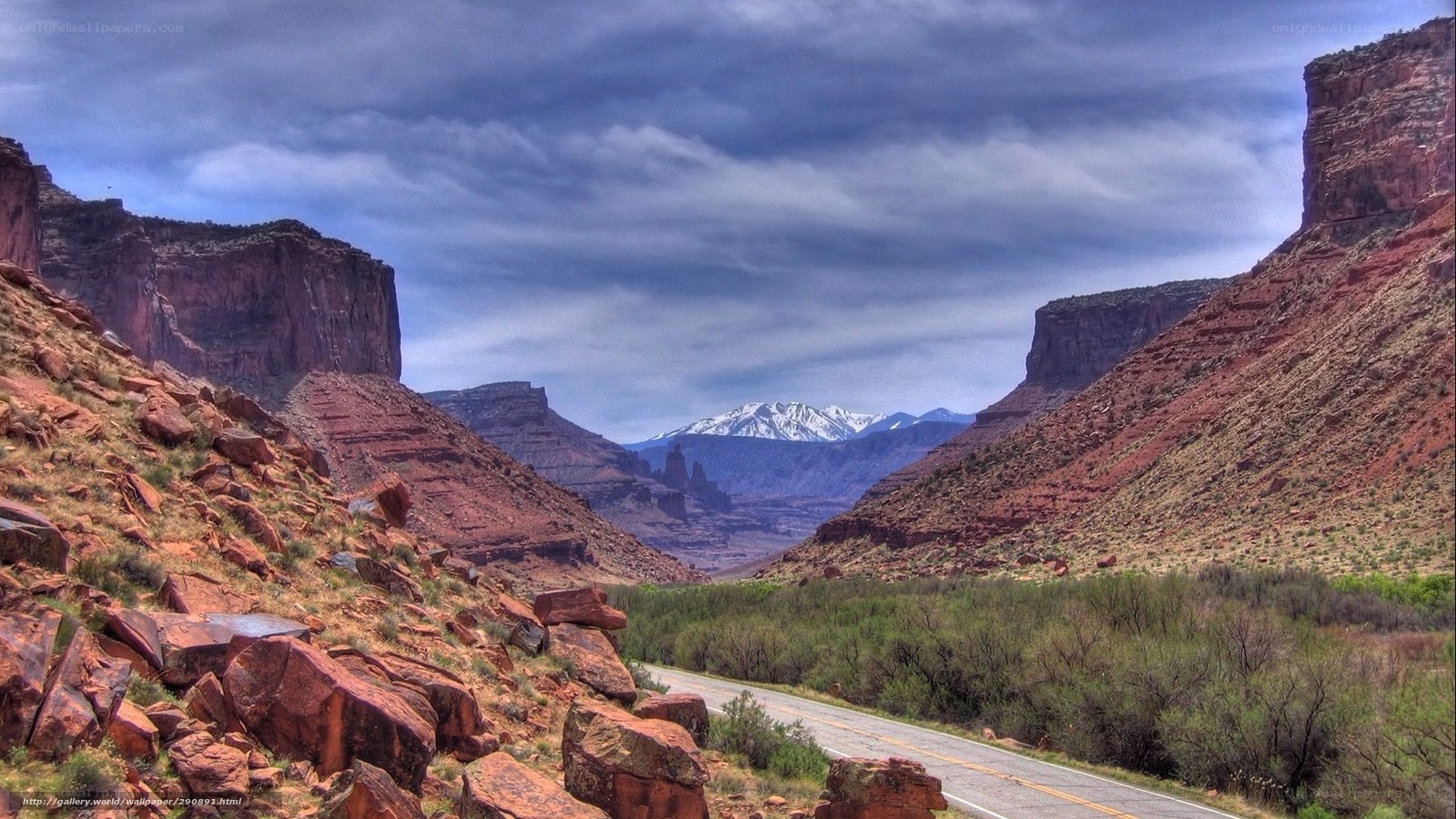 Red rock canyon with snow-capped mountains