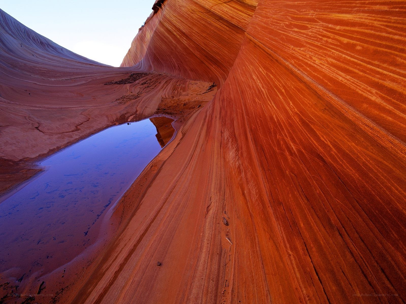 Red rock canyon with water pool