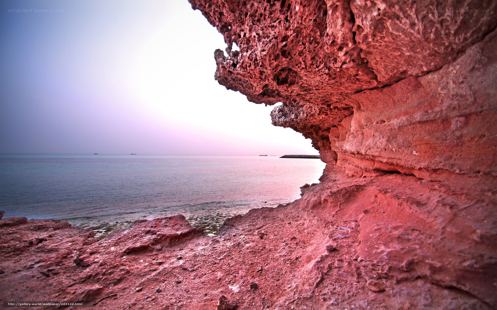 Red rock cave overlooking the sea
