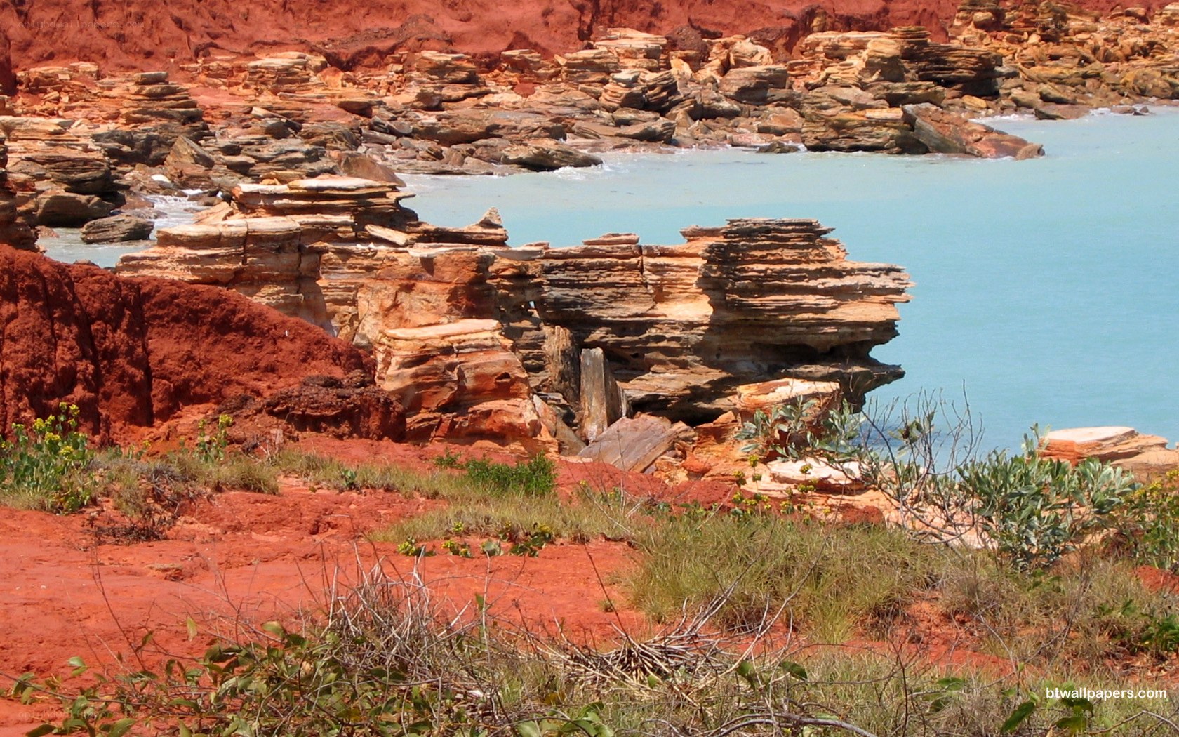Red rock coastal formations