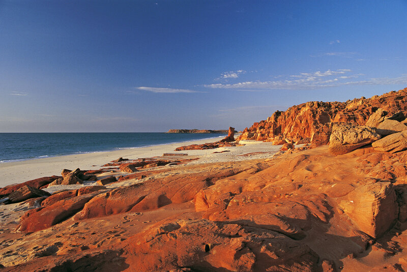 Red rock coastline at sunrise