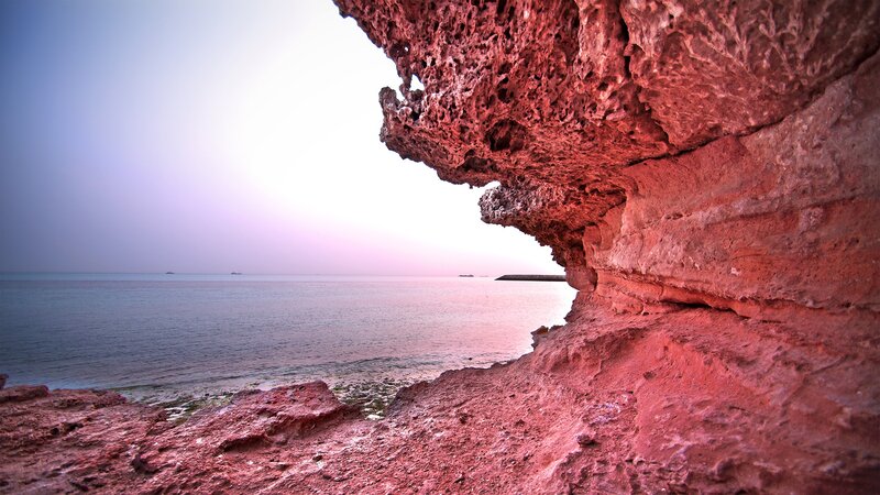 Red Rock Formation — Serene, Sunset, Photograph, Sea, Sky, Boat, Blue, White