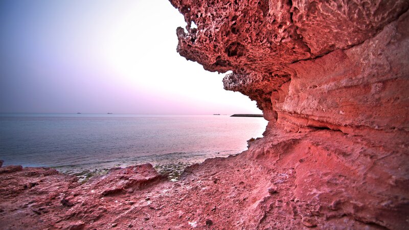 Red Rock Formation — Serene, Sunset, Photograph, Sea, Sky, Boat