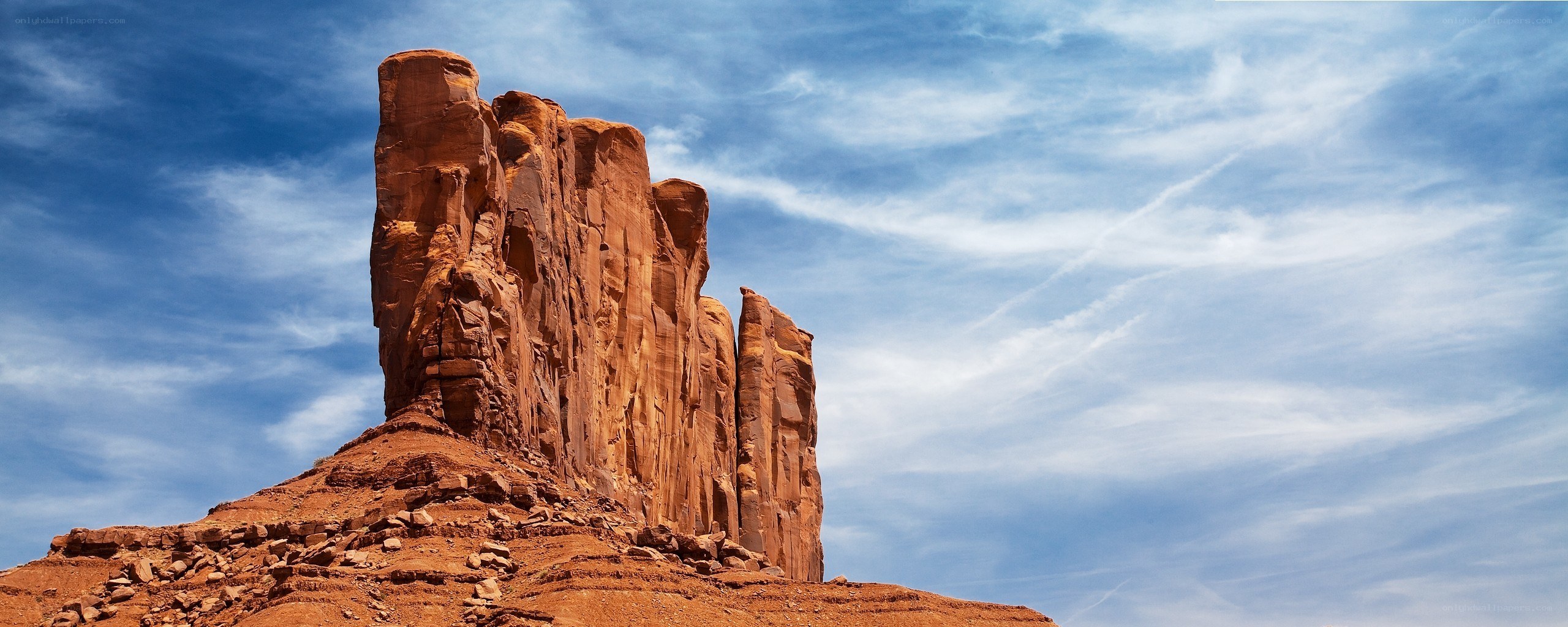 Red rock formation under blue sky