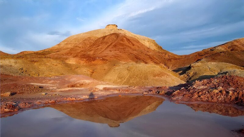Red rock formation with reflection