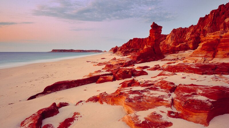 Red Rock Formations on Beach — Serene, Sunset