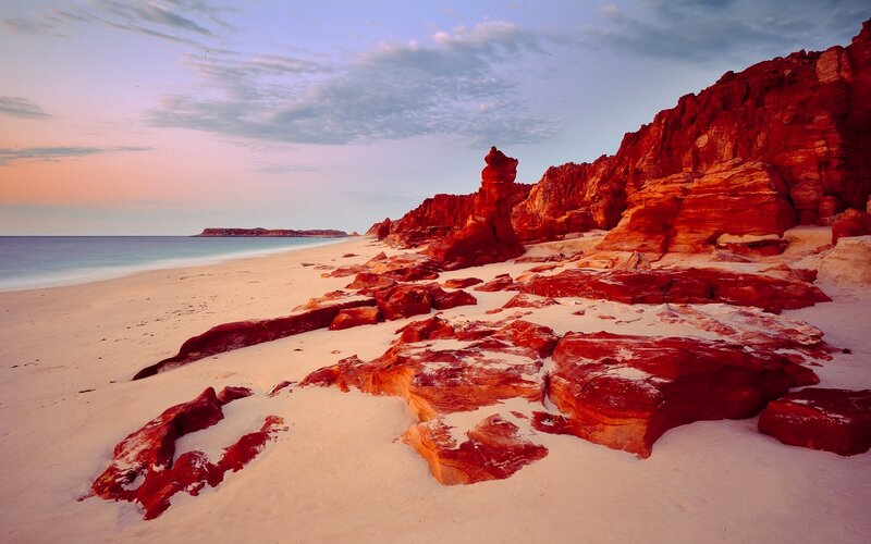 Red Rock Formations on Beach — Serene