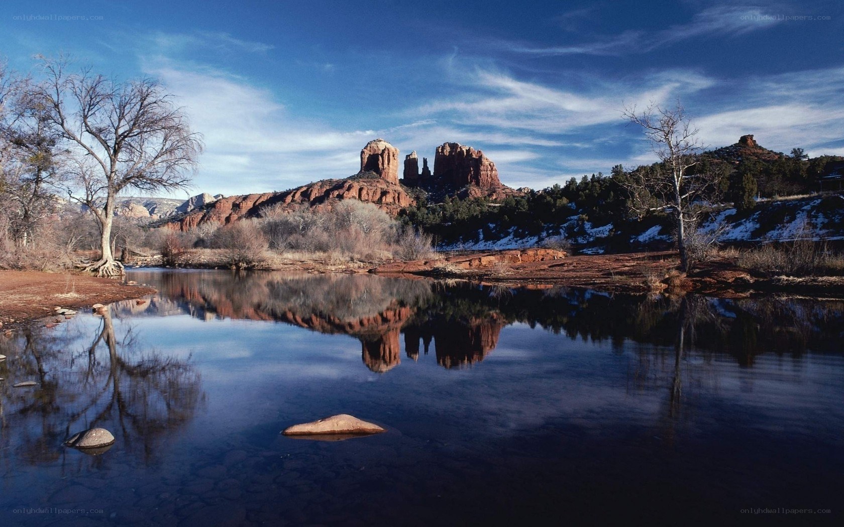 Red Rock formations reflected in a calm river