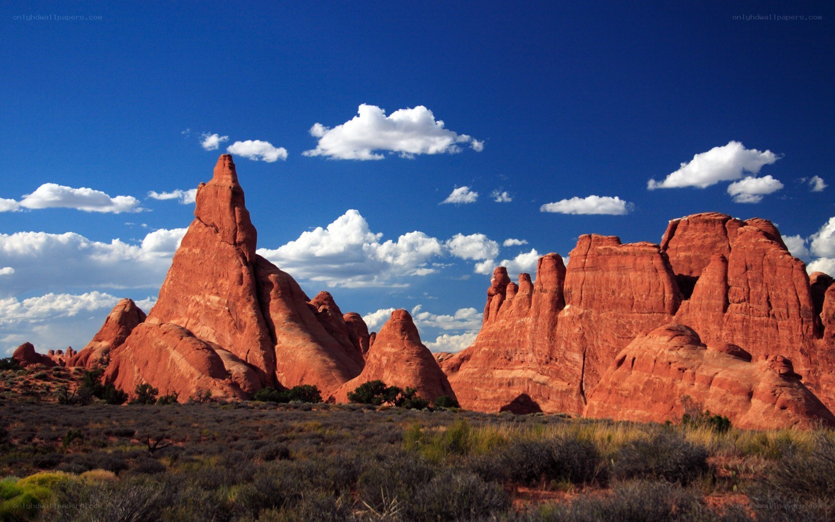 Red rock formations under blue sky
