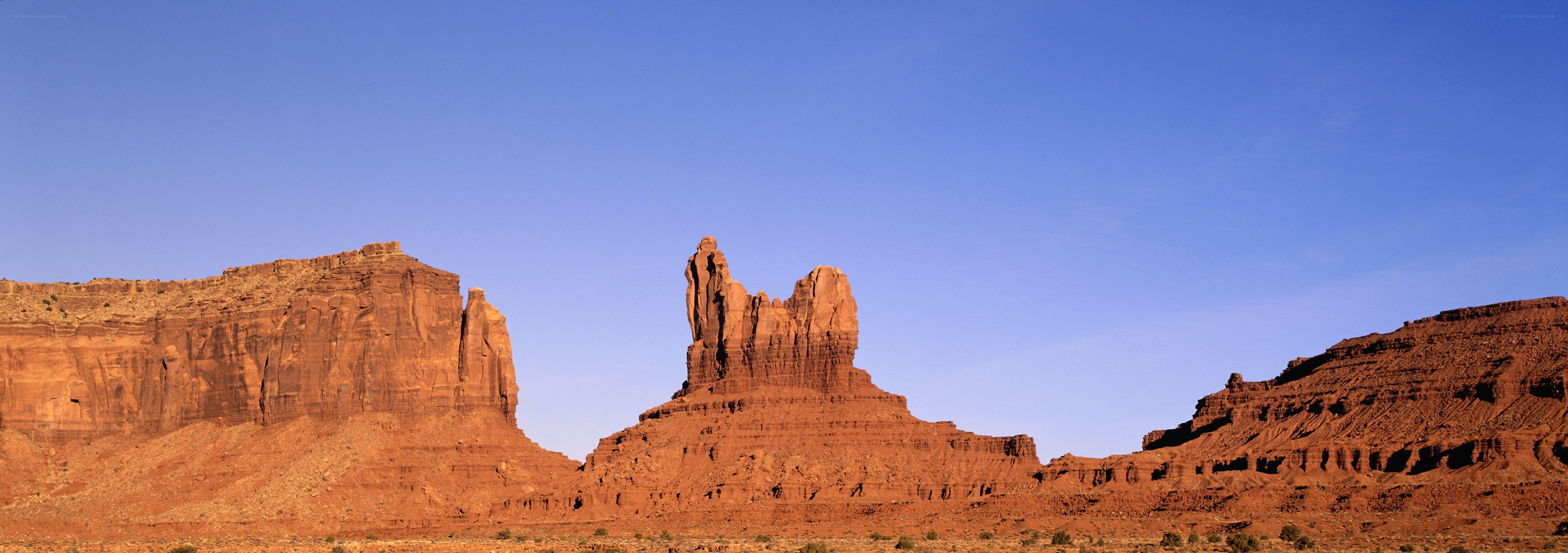 Red rock formations under blue sky