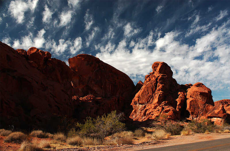 Red rock formations under cloudy sky