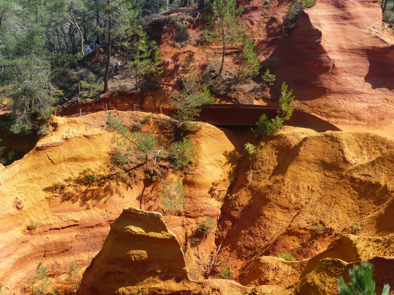 Red rock formations with bridge