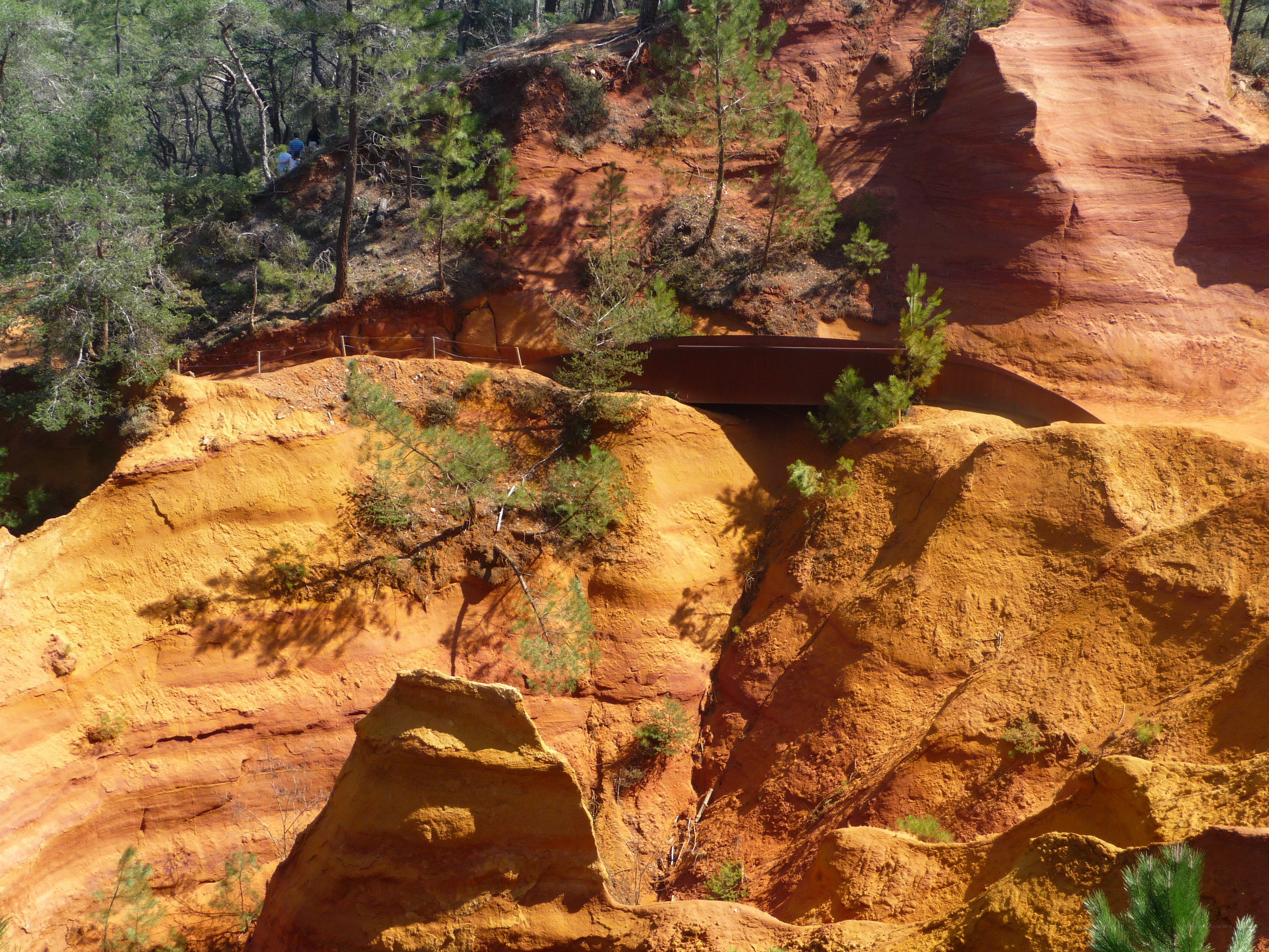 Red rock formations with bridge