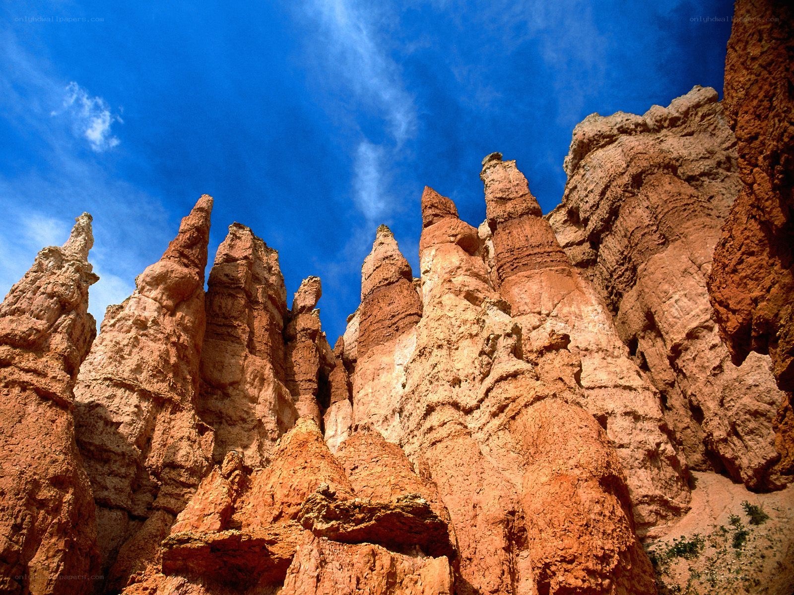 Red rock hoodoos under blue sky
