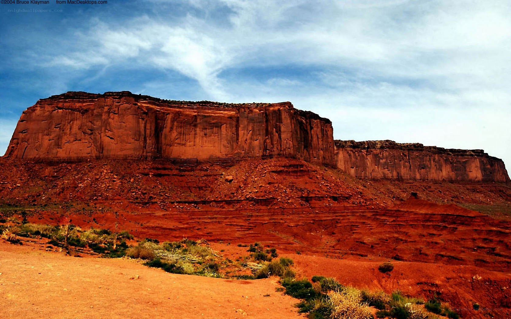 Red rock mesa under blue sky