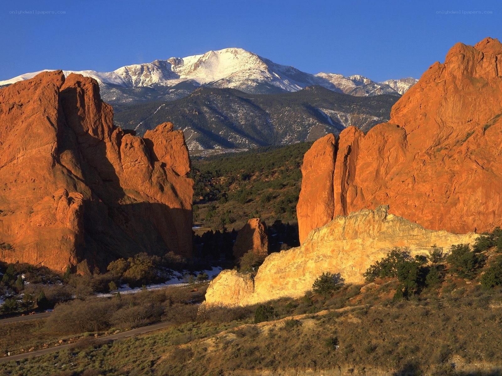 Red rocks and snow-capped mountains