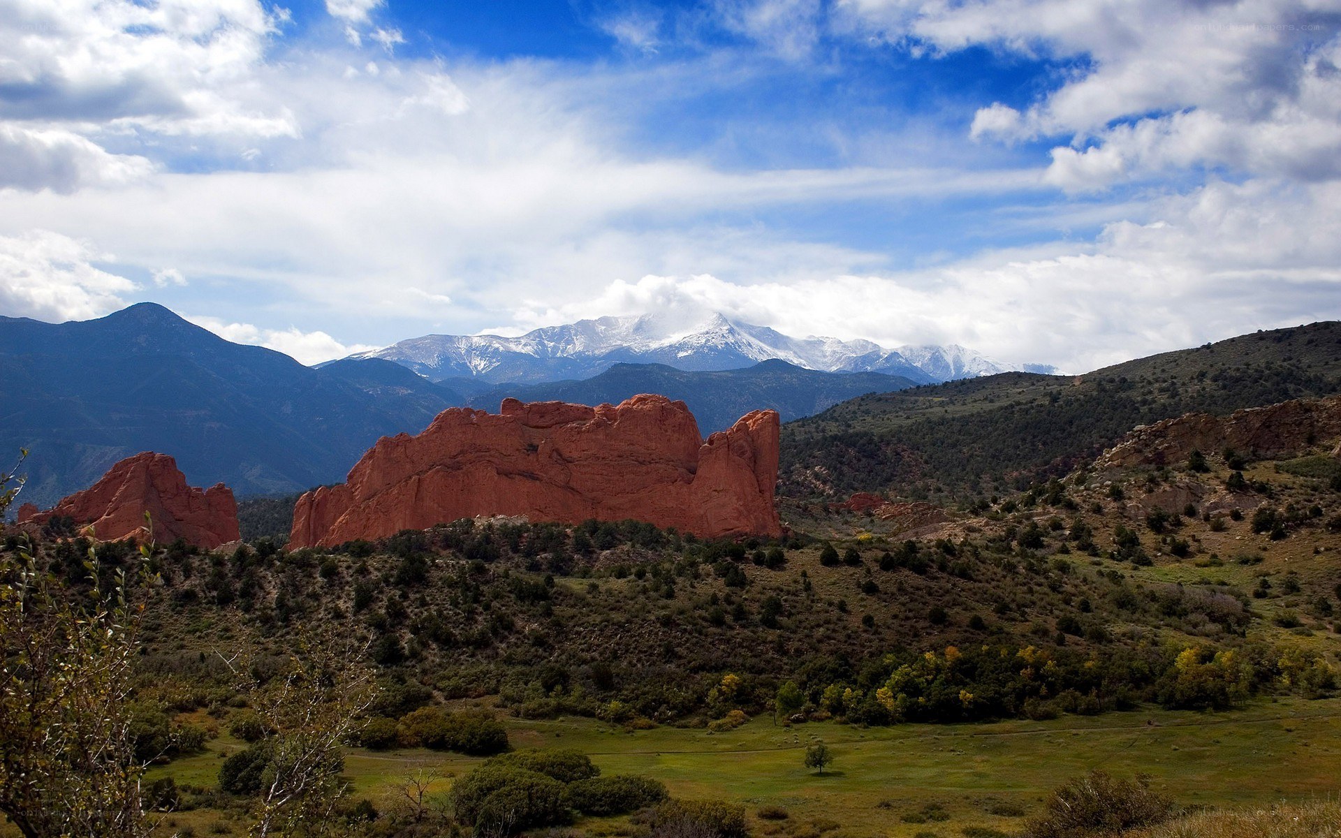 Red rocks and snow-capped mountains