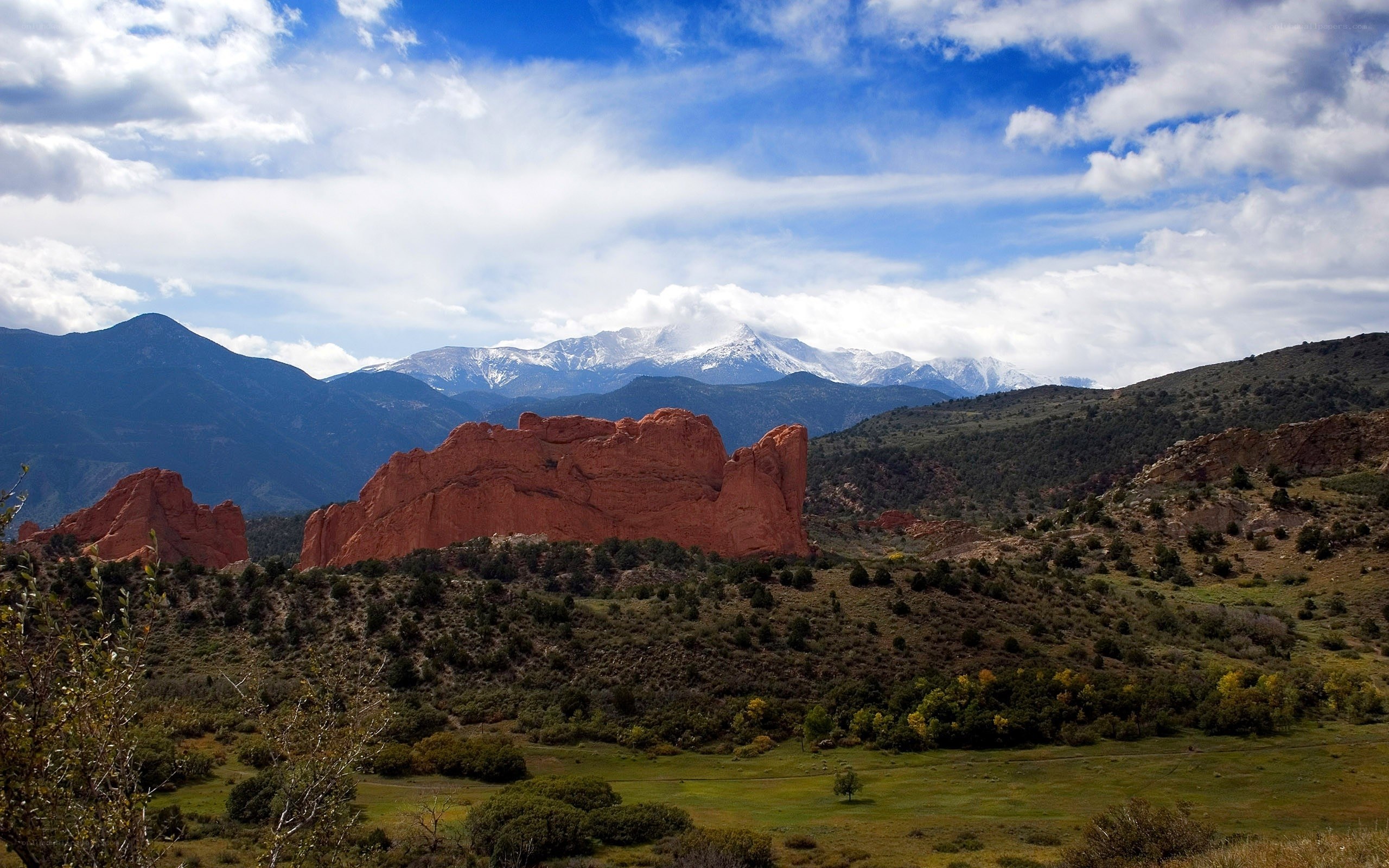 Red rocks and snow-capped mountains