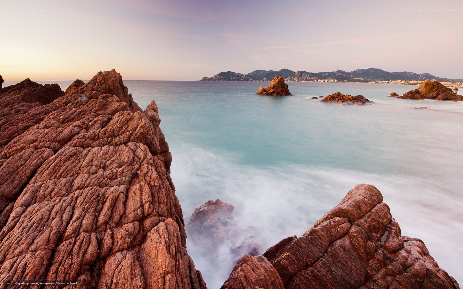 Red rocks at coastal sunset