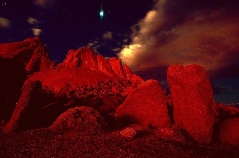 Red rocks under night sky