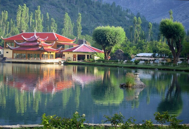 Red-roofed Building by Lake