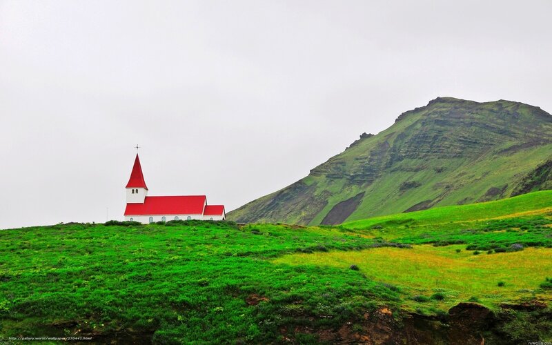 Red-roofed church on green hill