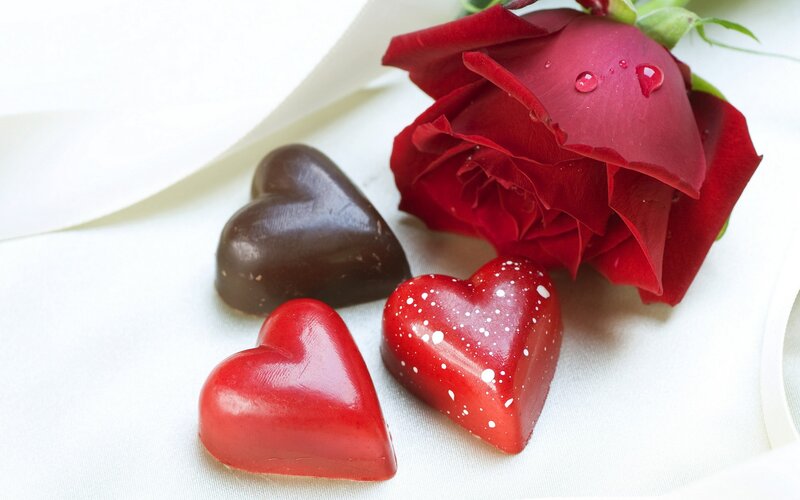 Red rose and heart-shaped chocolates