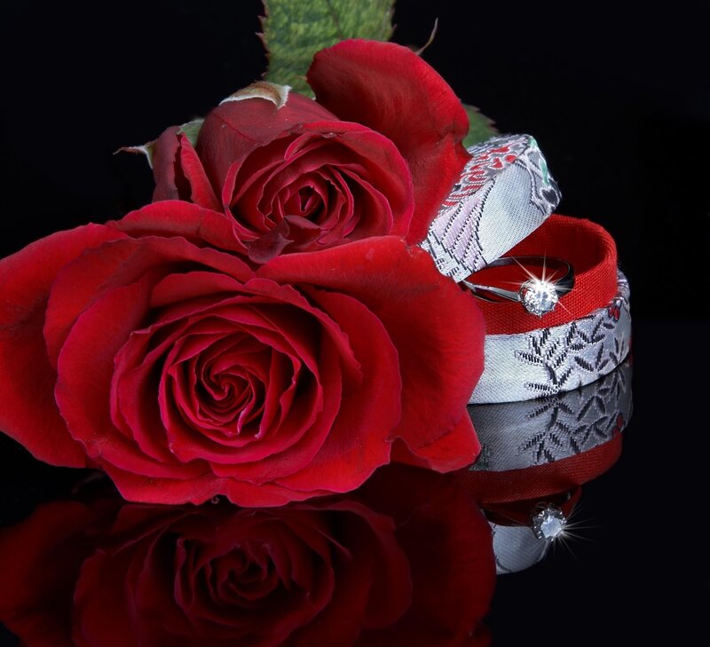Red roses and diamond ring