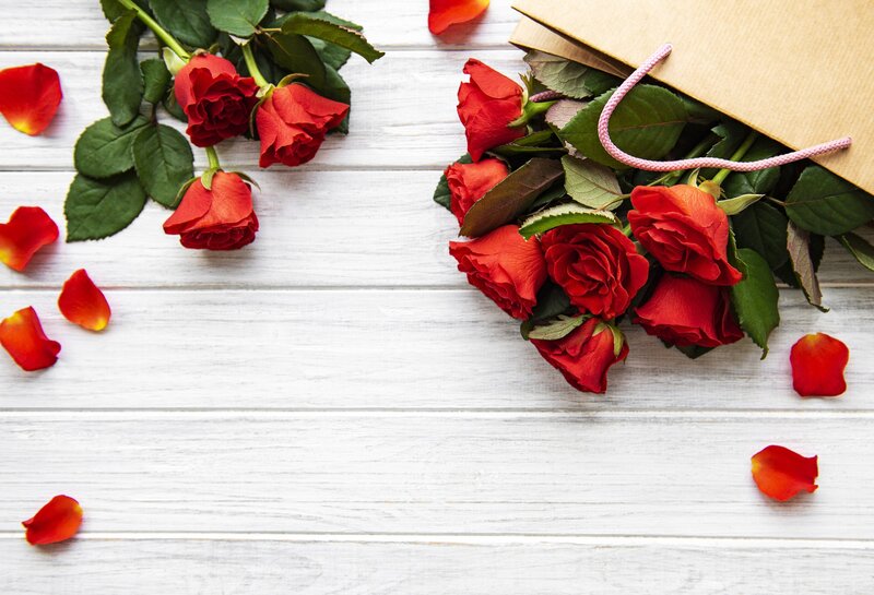 Red Roses in Paper Bag