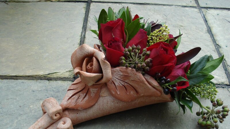 Red Roses in Terracotta Holder