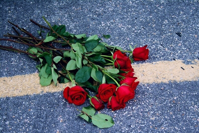 Red Roses on Pavement — Somber