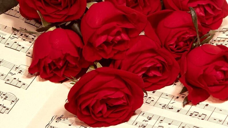 Red Roses on Sheet Music — Romantic