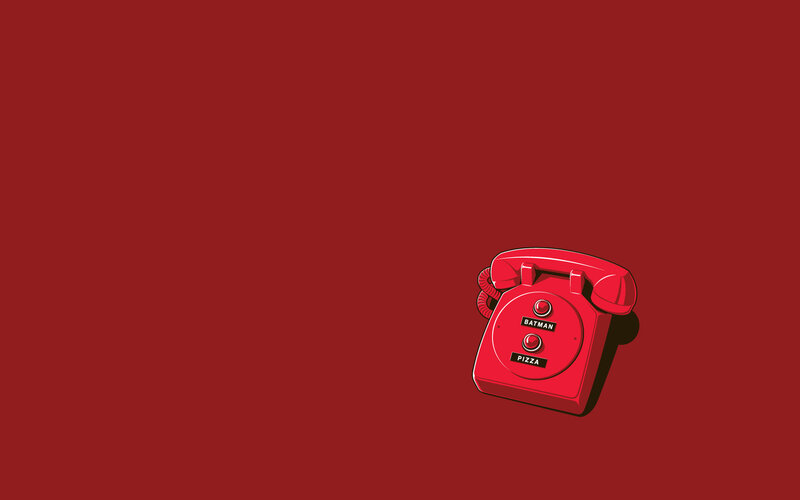 Red rotary phone with Batman and Pizza buttons