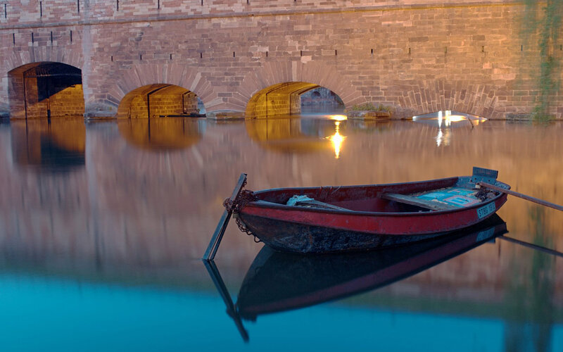 Red Rowboat on Water — Blue