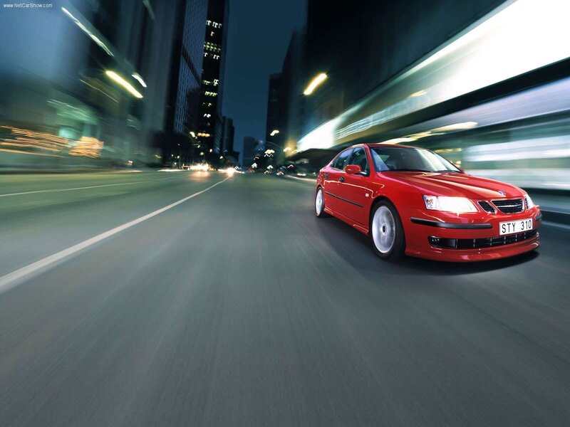 Red Saab speeding through city
