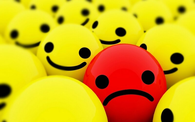 Red Sad Face Among Yellow — Smiley Faces