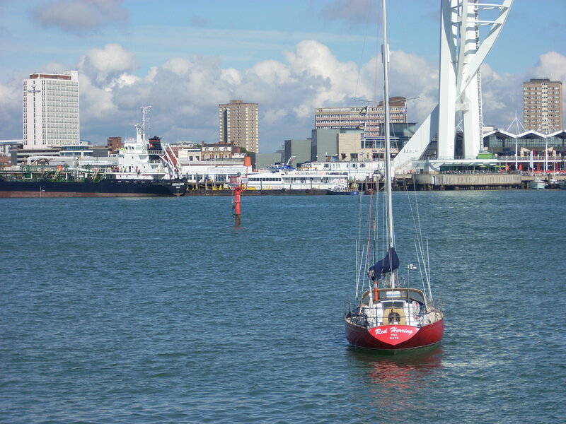 Red Sailboat in Harbor