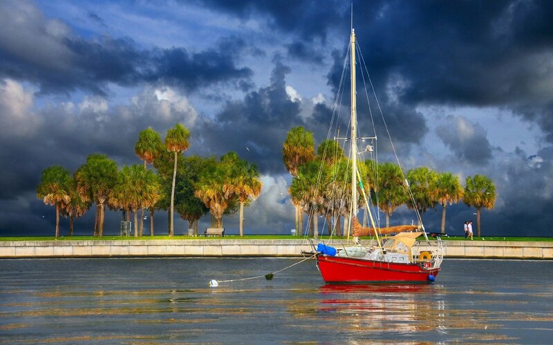 Red Sailboat in Water — Dramatic