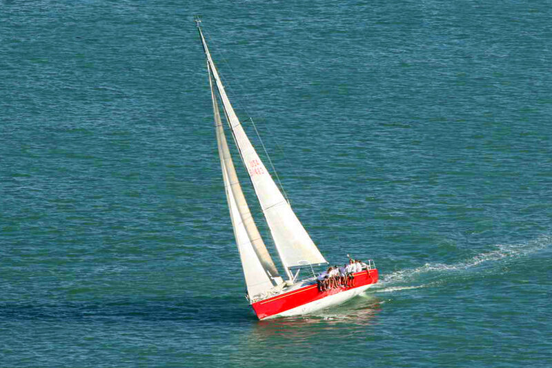 Red Sailboat on Water