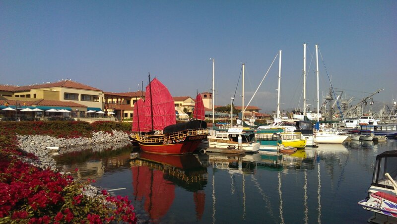 Red-sailed Boat in Marina