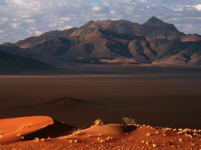 Red Sand Dunes and Mountains