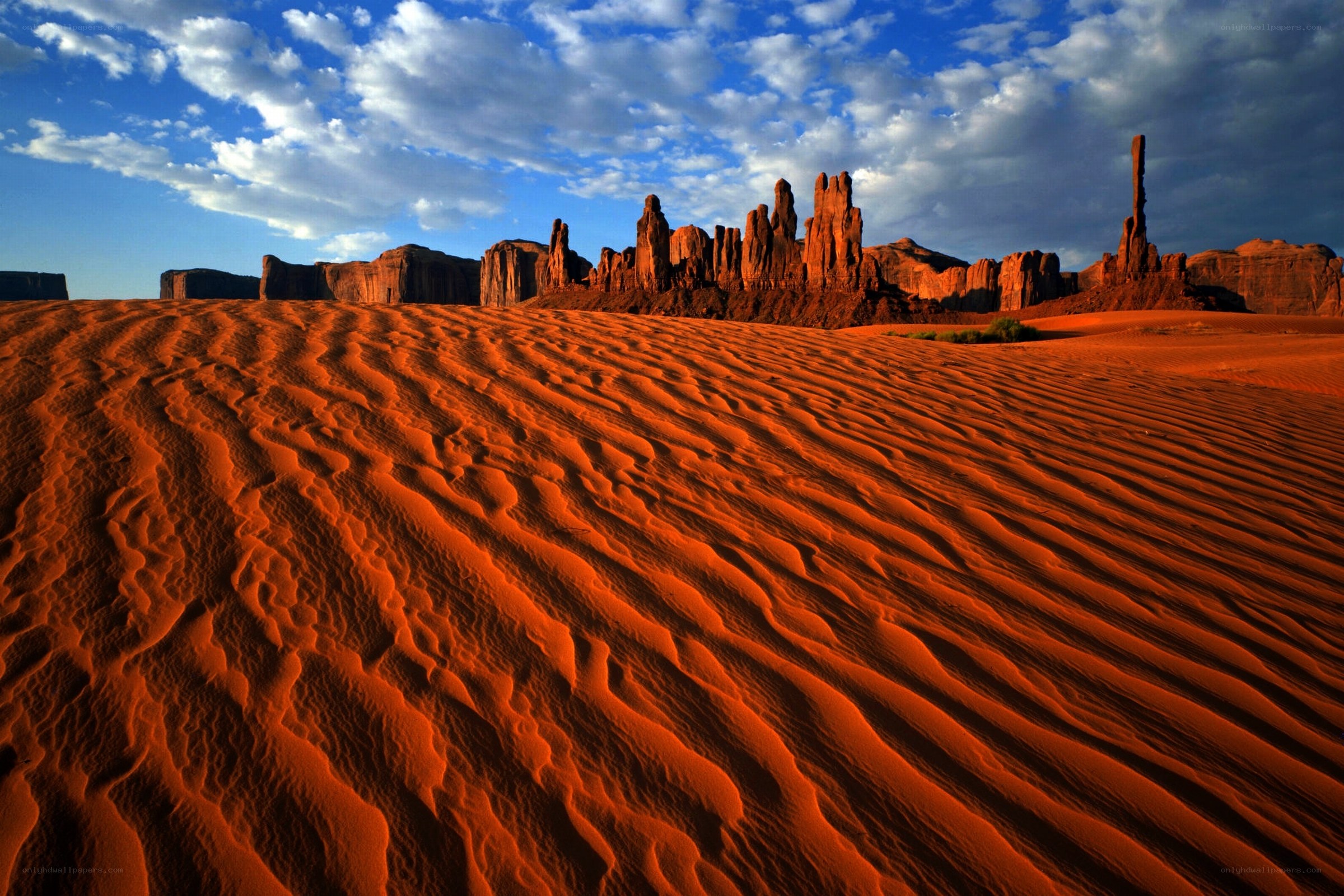 Red sand dunes and rock formations