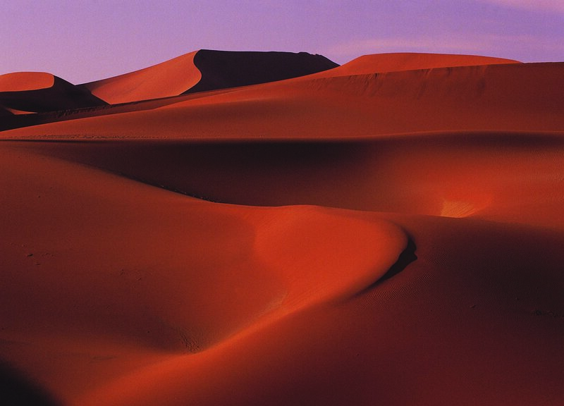 Red sand dunes at dusk