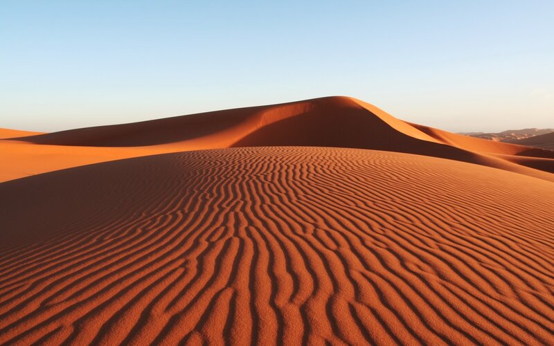 Red sand dunes at sunset