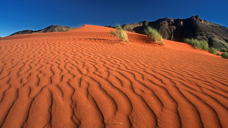Red sand dunes in desert