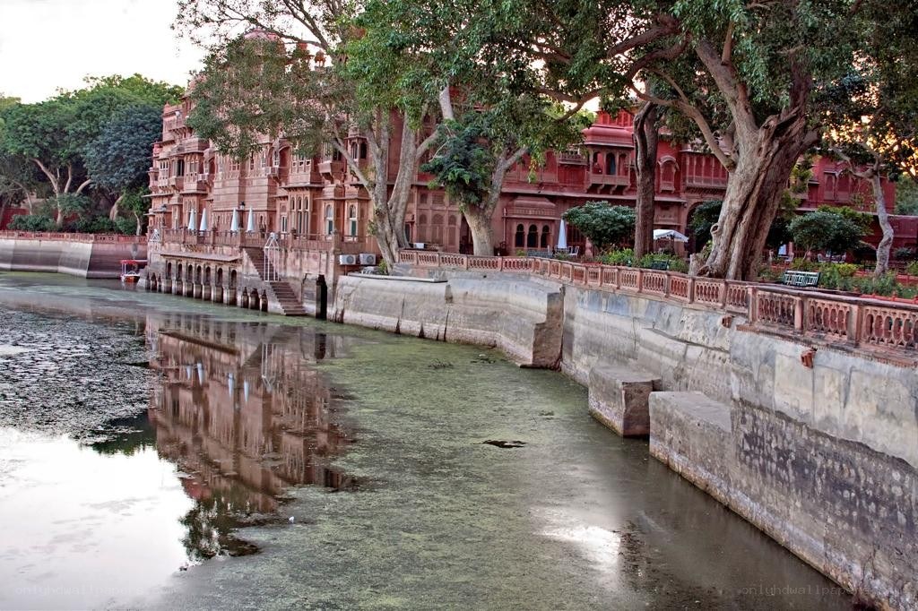 Red sandstone palace by river